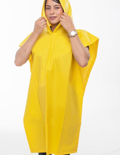 Woman wearing a waterproof coffee grower's poncho