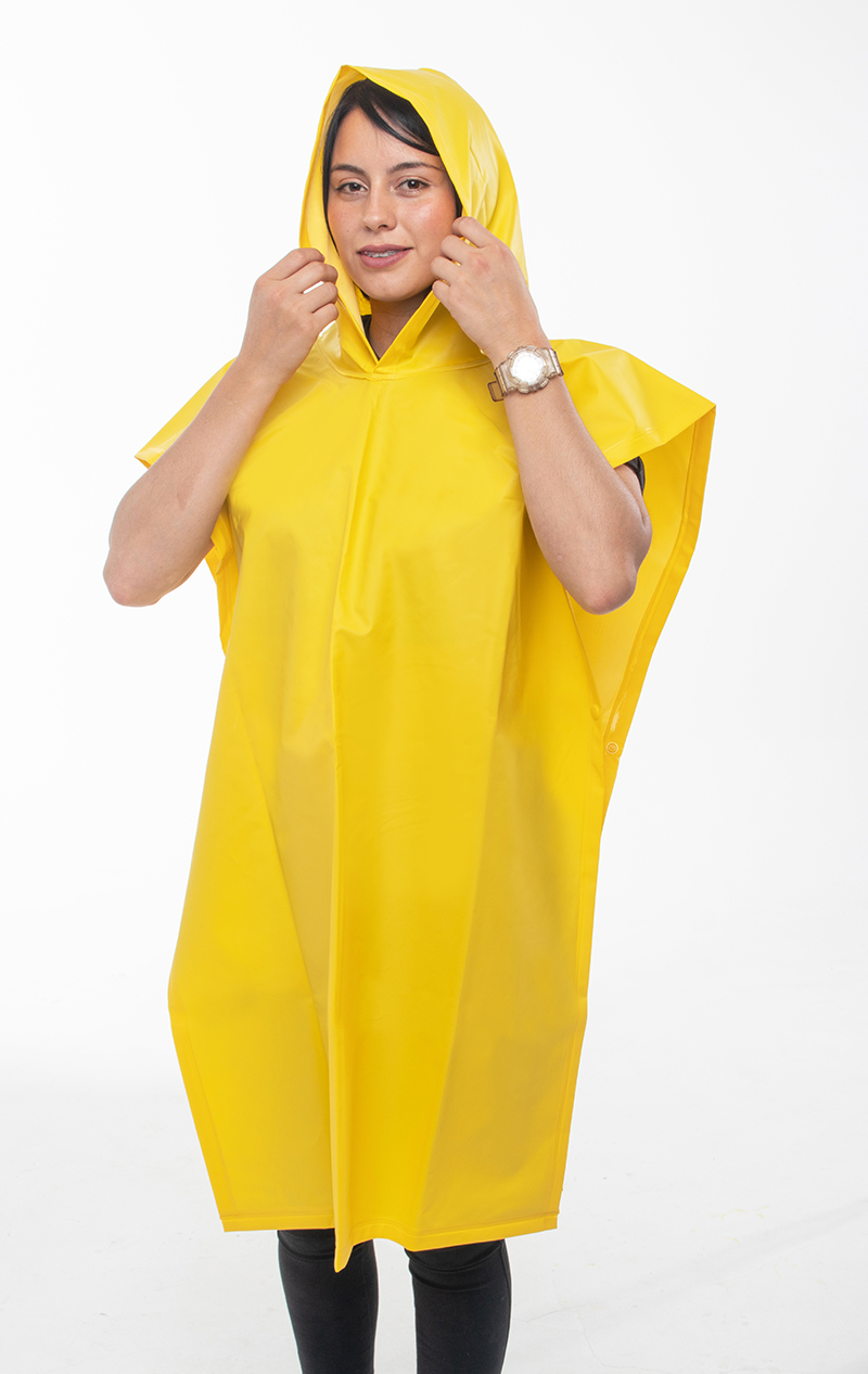 Woman wearing a waterproof coffee grower's poncho