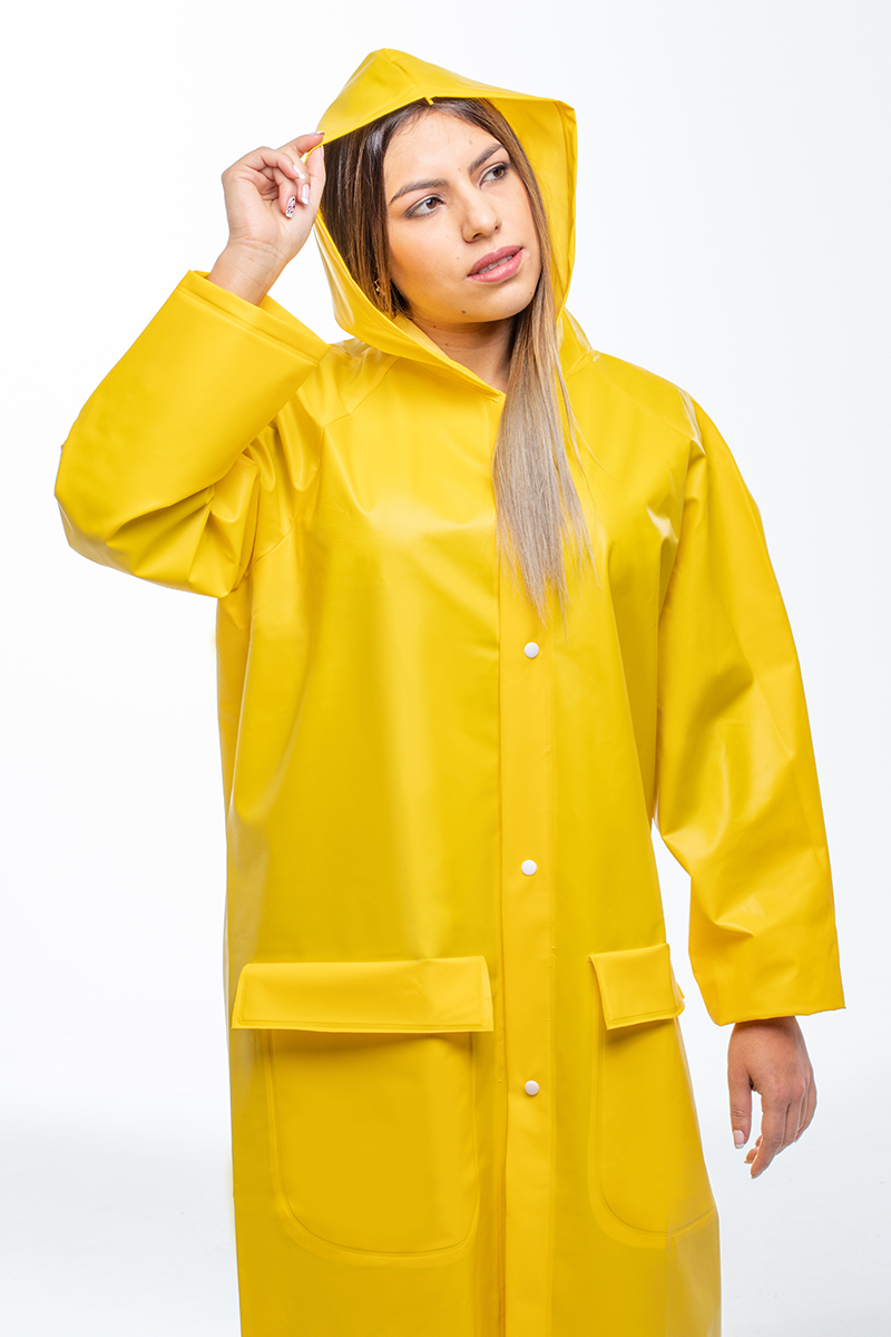 Woman wearing a waterproof coat with hood and indirect ventilation