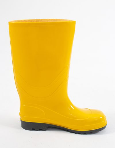 Detail of a yellow rubber safety swamp boot and a sole