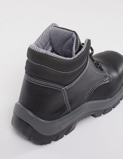 Detail of the sole of a black leather safety boot