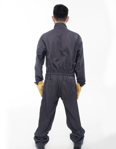 Man from behind wearing a one-piece drill work outfit