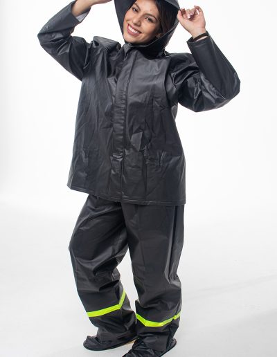 Woman wearing a 4-piece motorcycle rain suit
