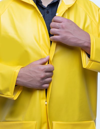 Detail of the chest of a two-piece waterproof suit with snap fasteners