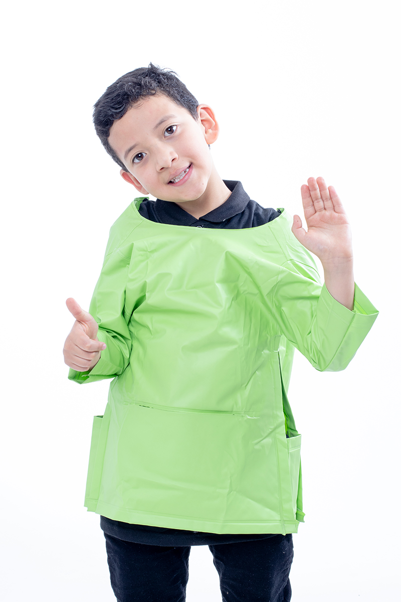 Boy waving with a thumbs up while wearing a green waterproof apron with sleeves