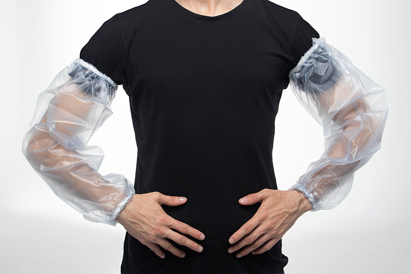 Man wearing transparent waterproof sleeves