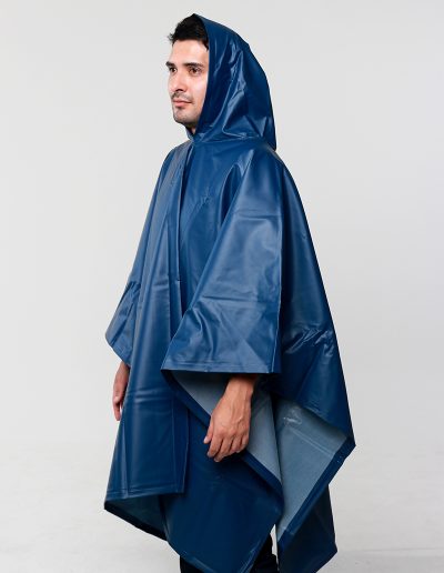 Man wearing a blue waterproof poncho