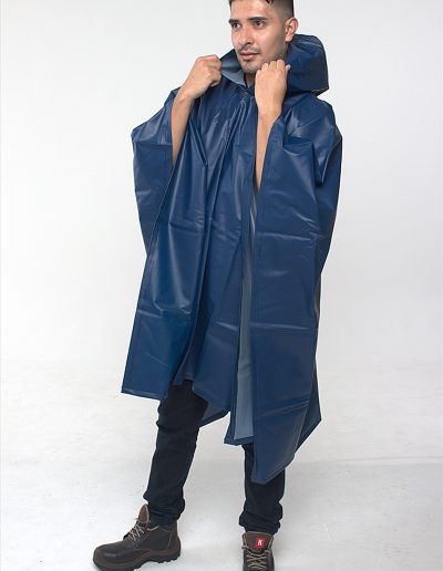 Man wearing a blue waterproof poncho