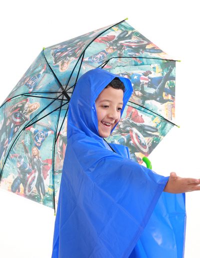 Child wearing a blue waterproof poncho and holding an umbrella