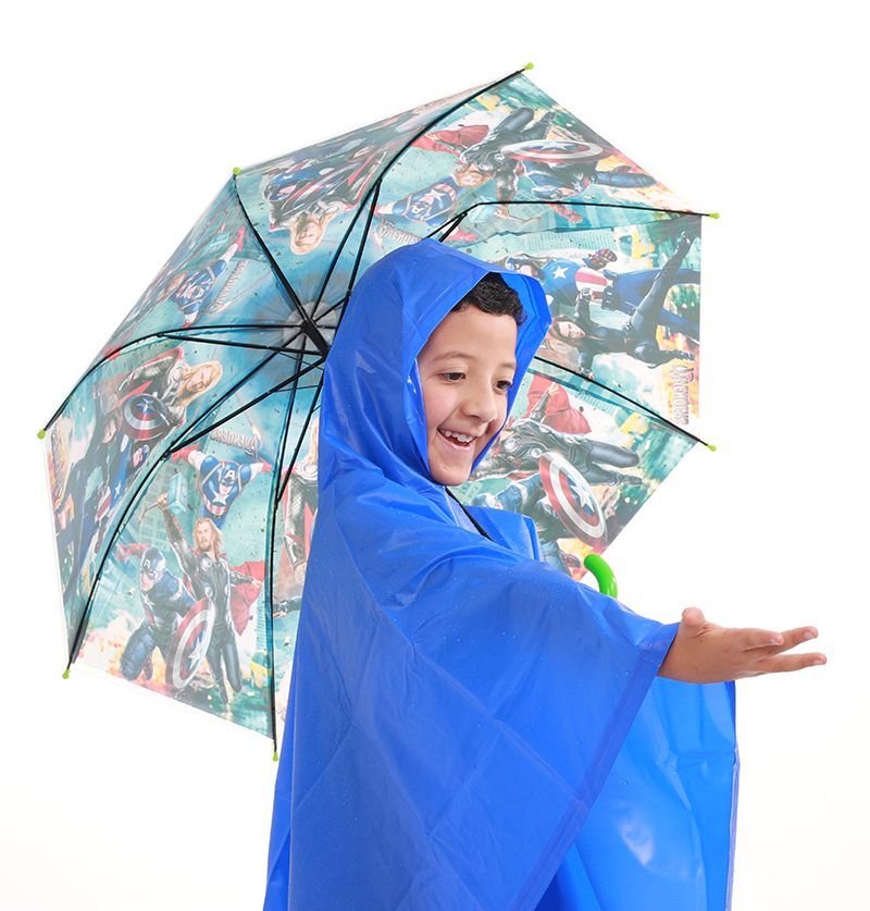 Child wearing a blue waterproof poncho and holding an umbrella